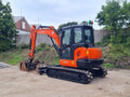 Miniexcavadora Kubota KX057-4 de 6 t usada 2017 con 1759 h con pinza y horquillas