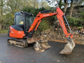 Miniexcavadora Kubota KX61-3 de 2,6 t usada 2015 cabina cerrada de 3.243 h con 3 cucharones
