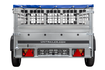 Remolque de un eje sobre ballestas 264x125 UNITRAILER GARDEN 264/R BASCULANTE con laterales de rejilla, marco en H y lona azul